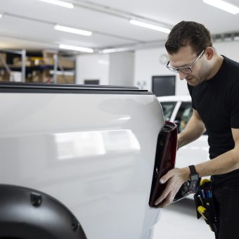 medium-shot-man-fixing-car